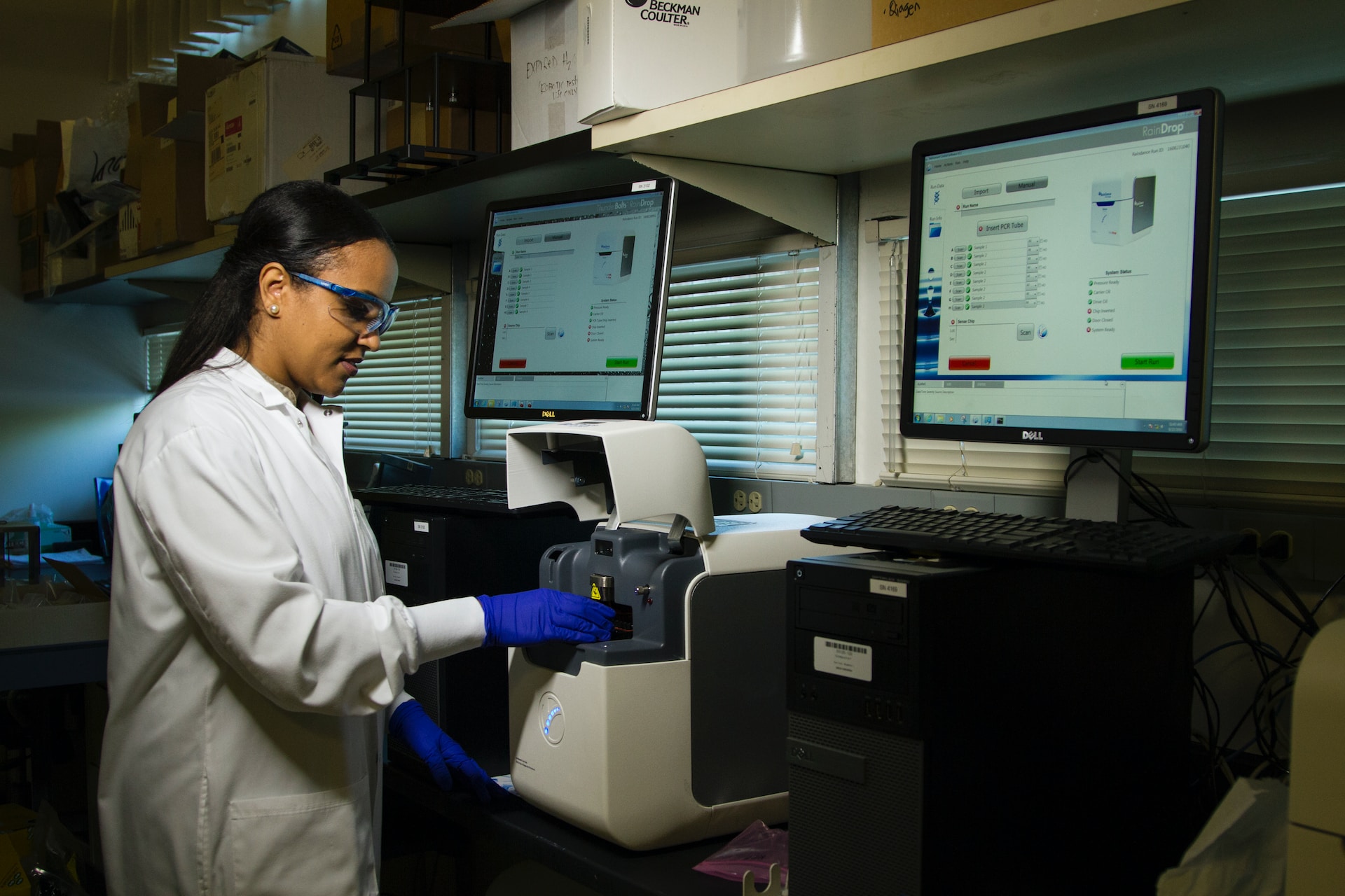 A healthcare worker using a machine at the National Cancer Institute.