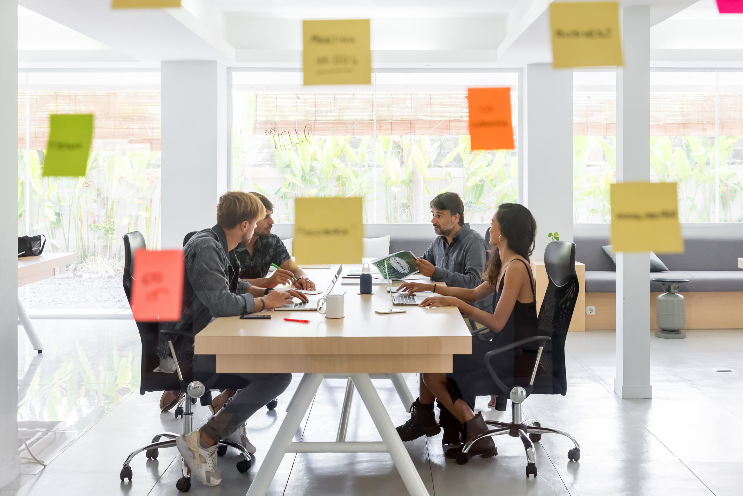 Group of young entrepreneurs working toghether in a coworking space