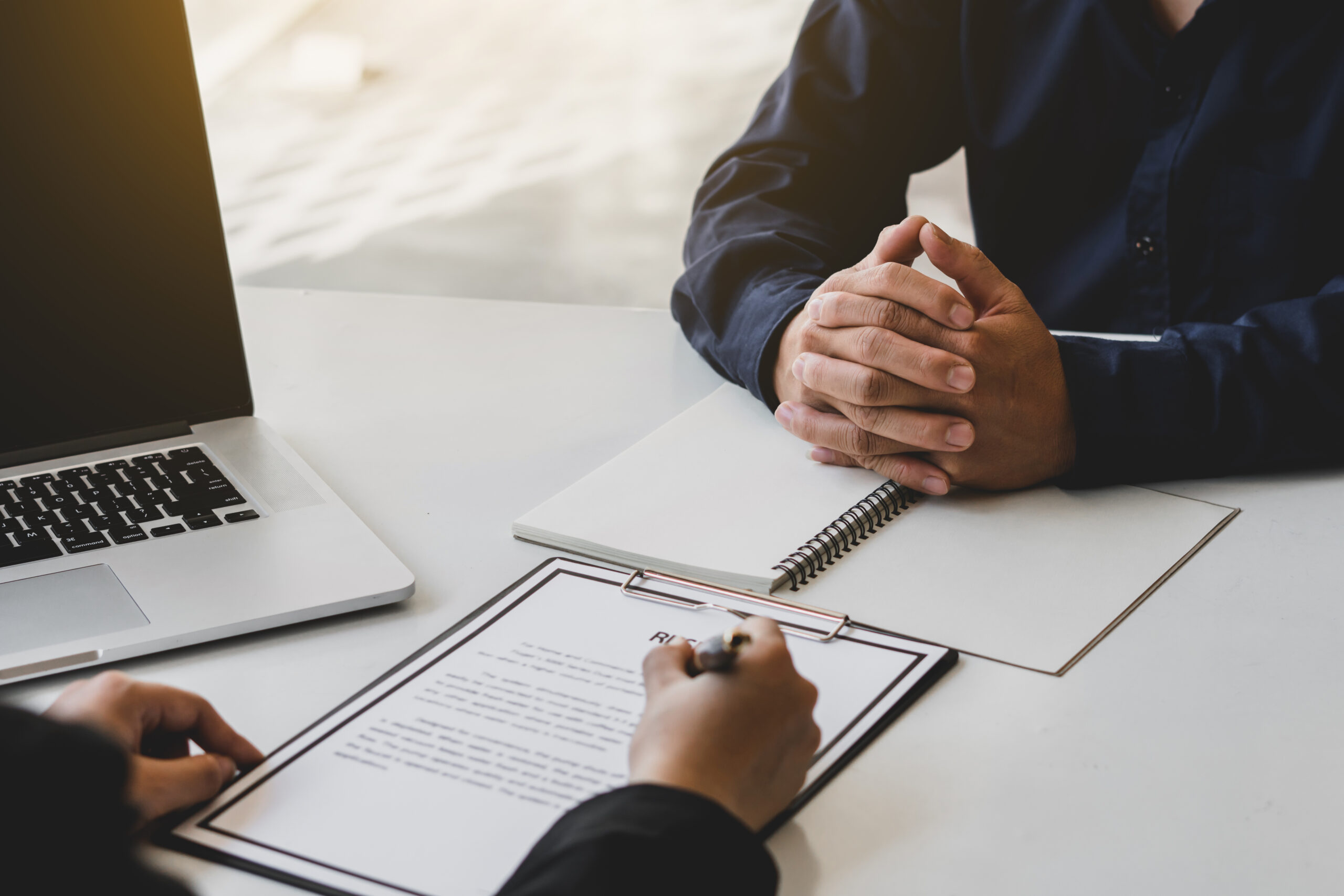 Job interviewer examining resume. To check the history and abili Job interviewer examining resume. To check the history and ability of those who apply for the job that meet the company needs or not.