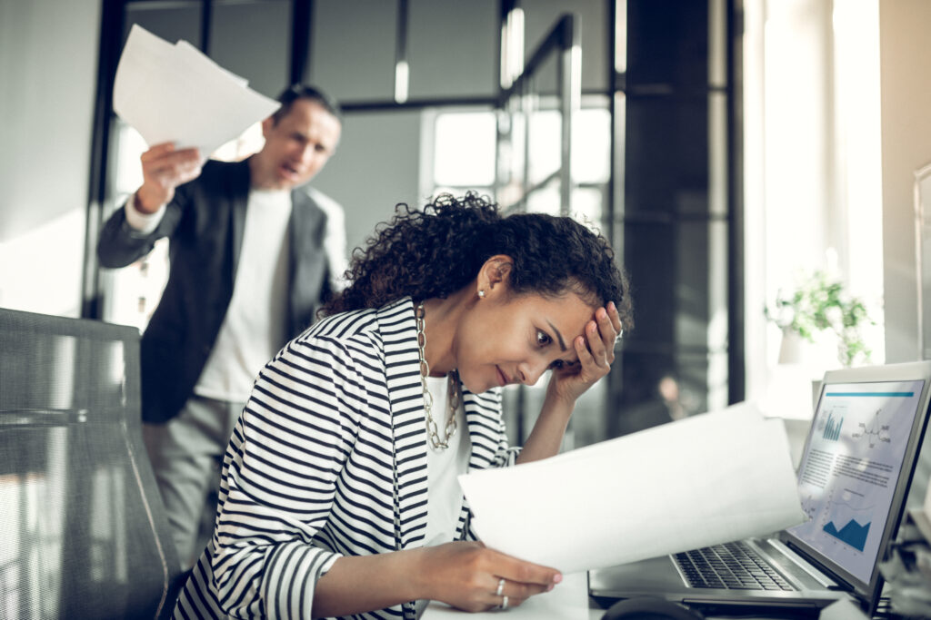 Employee feeling guilty for not completing the task while listening to angry boss