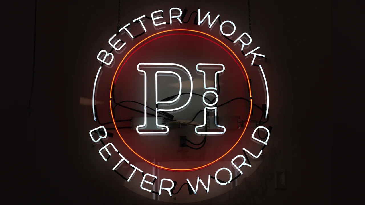 Better Work, Better World neon sign