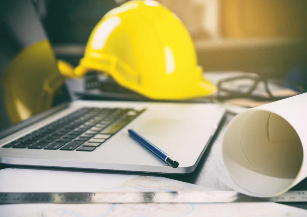 construction office desk with computer and tools