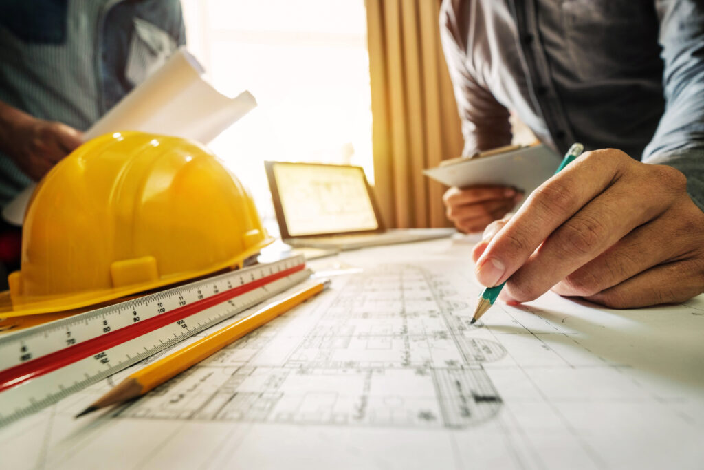 A construction manager working on a blueprint