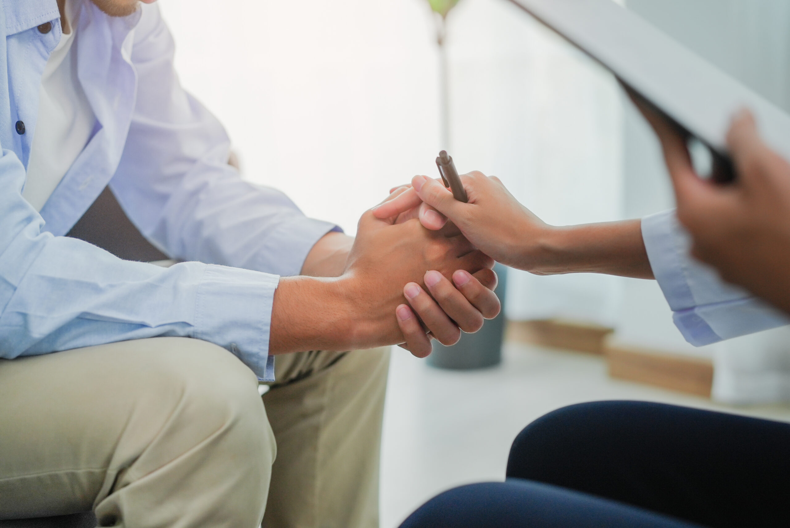 Men talk with a psychologist during talking therapy stressed men Men talk with a psychologist during talking therapy stressed mental health at office
