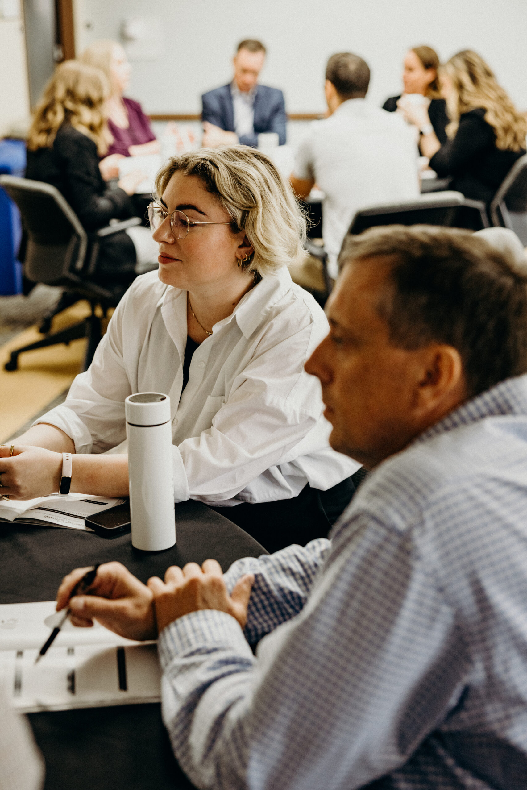 A group talking at a round table discussion