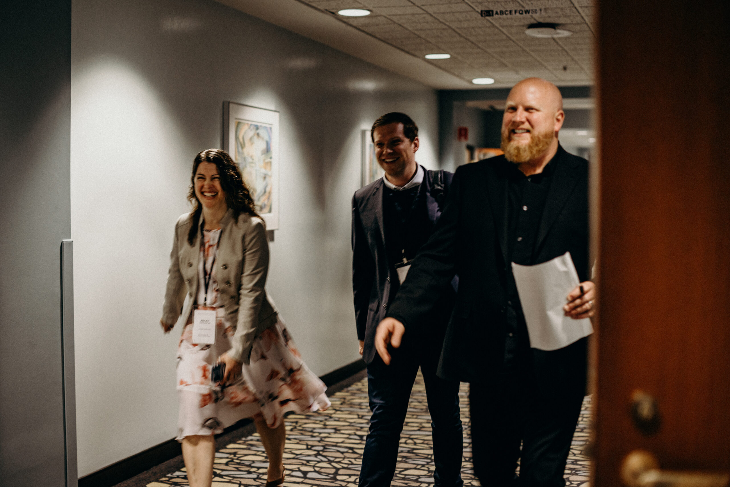 Progress22-348 A group of Titus executives walking down the hall