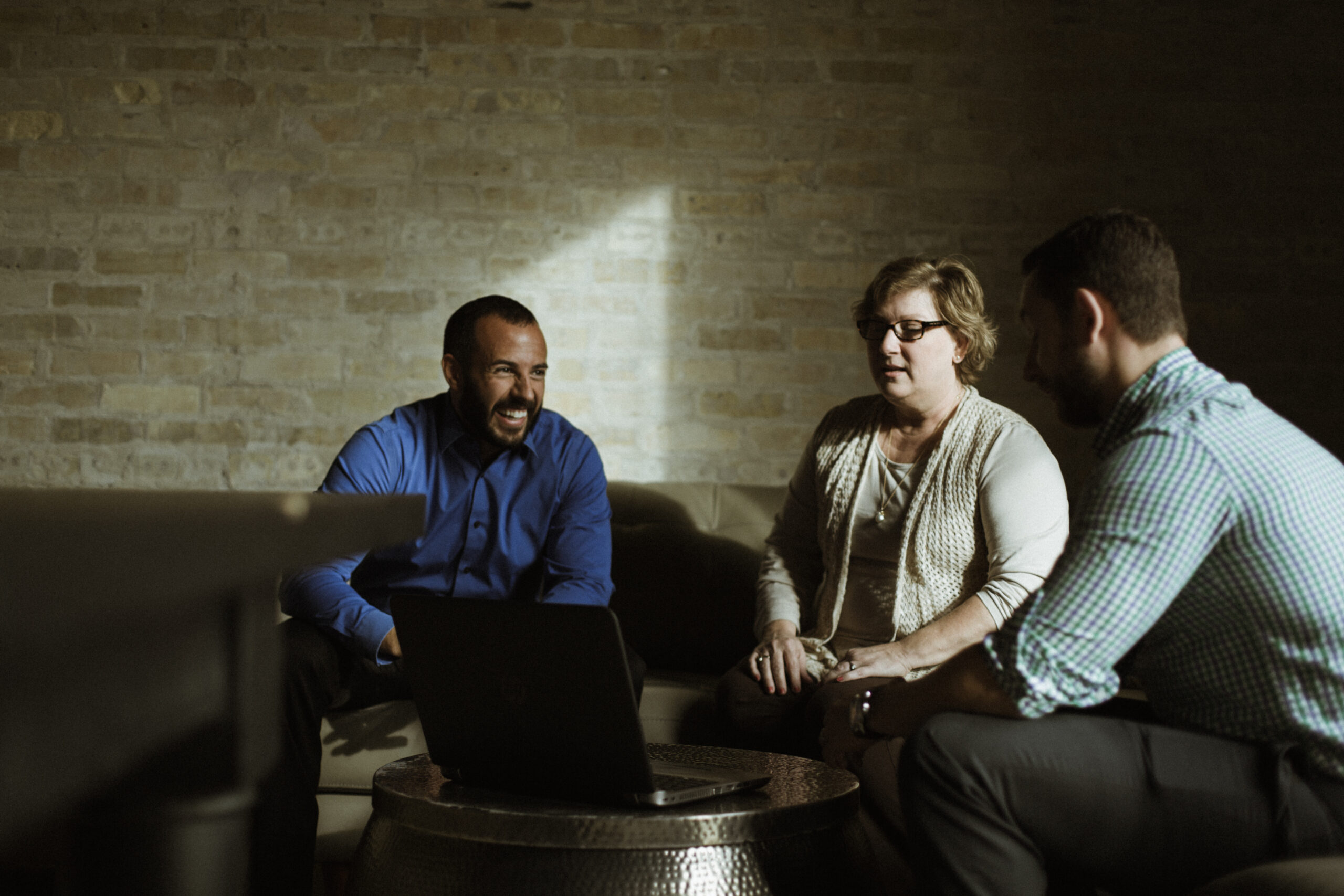 A group of Titus employees talking at the office