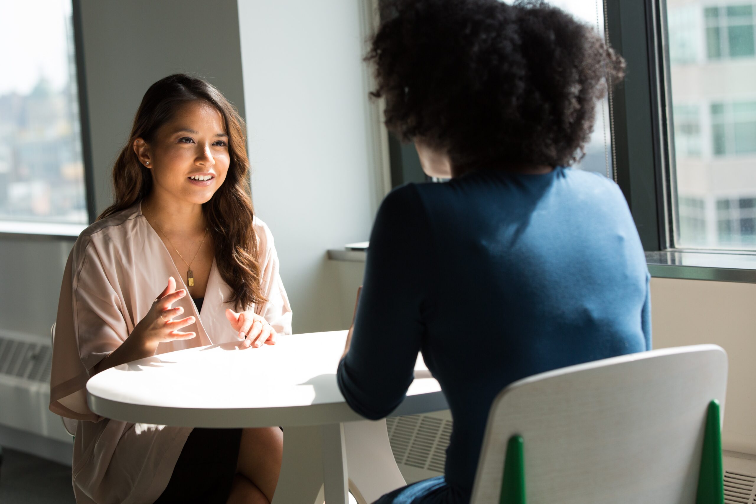 Two young women talking