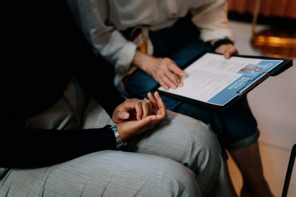 Two employees reviewing a resume
