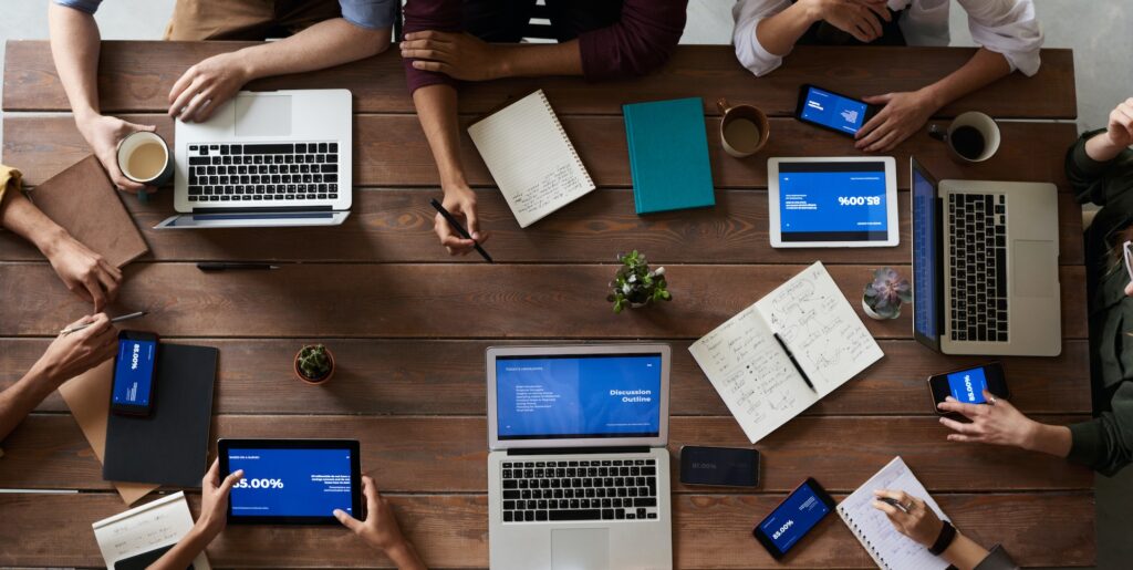 A group of people working on their laptops