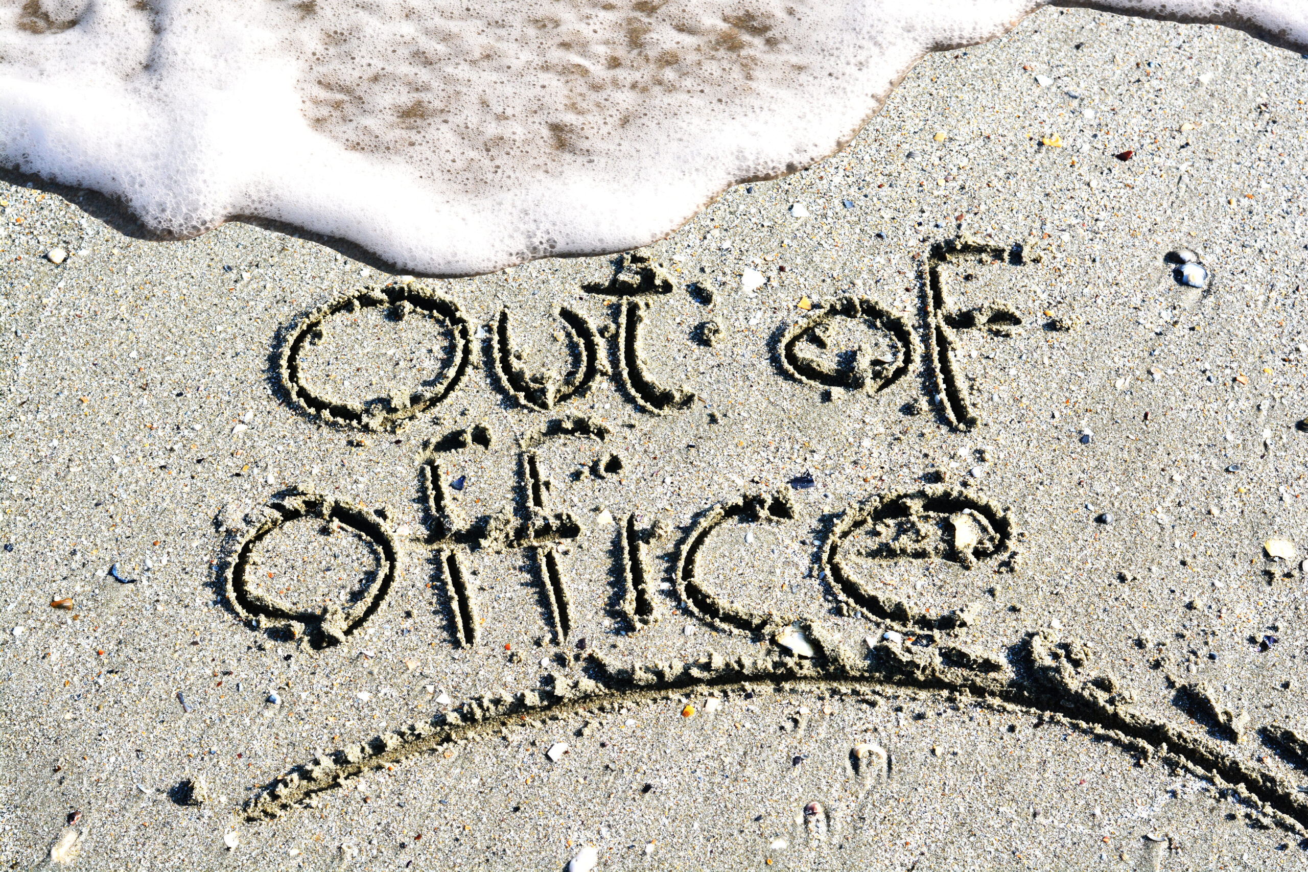 Out of office text written on the beach Out of office text written on the beach