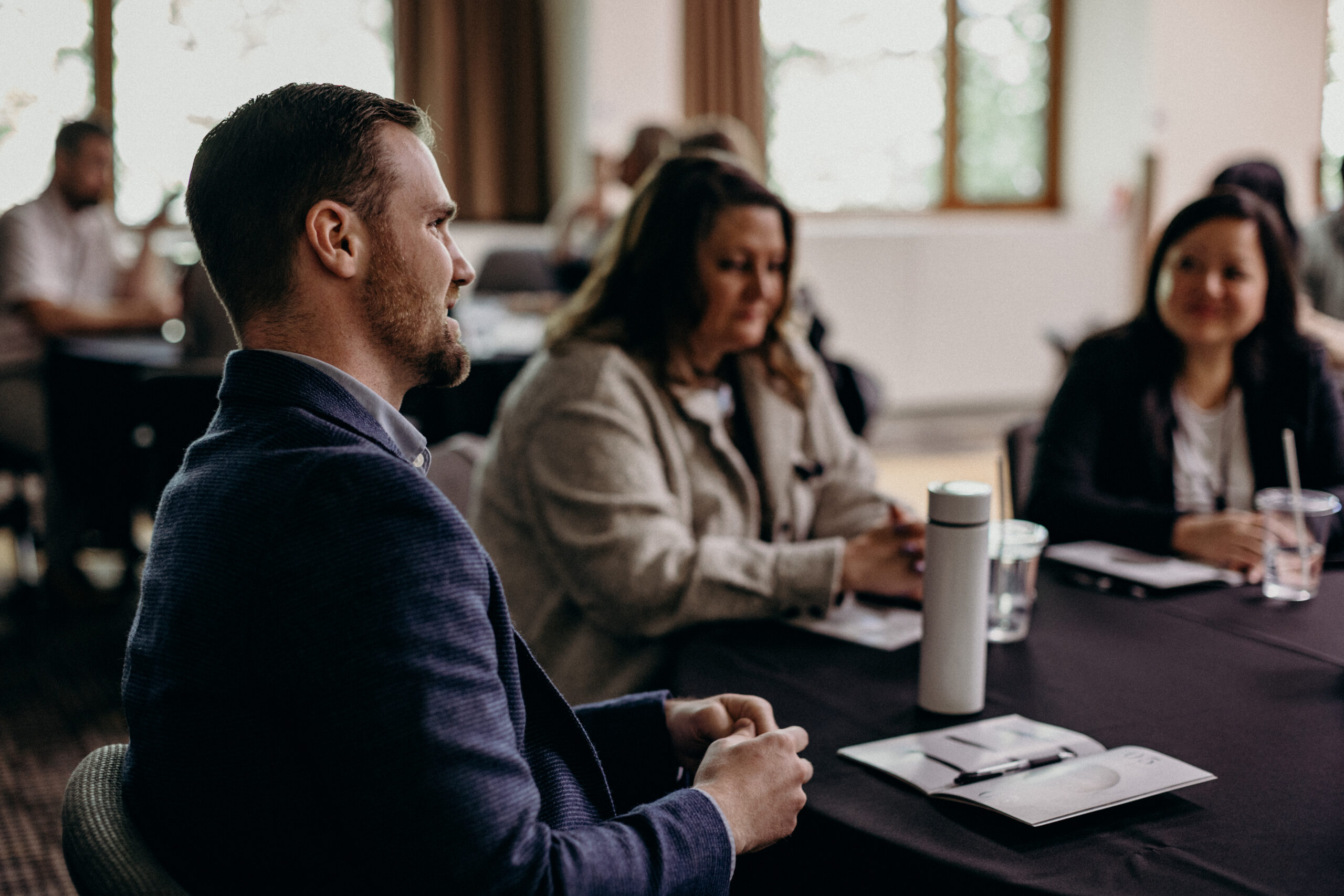 Business leaders talking at a roundtable