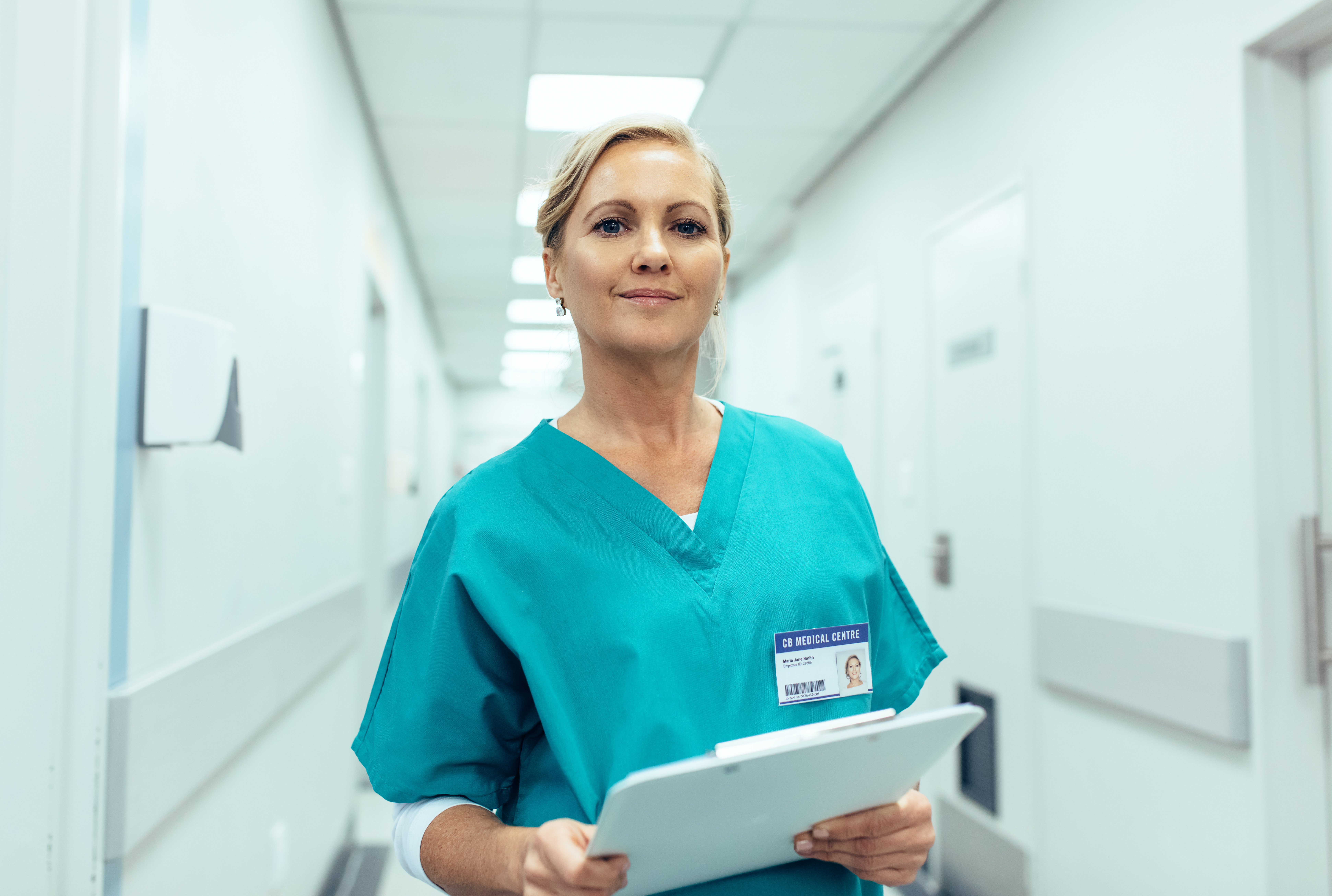 A nurse holding a clip board