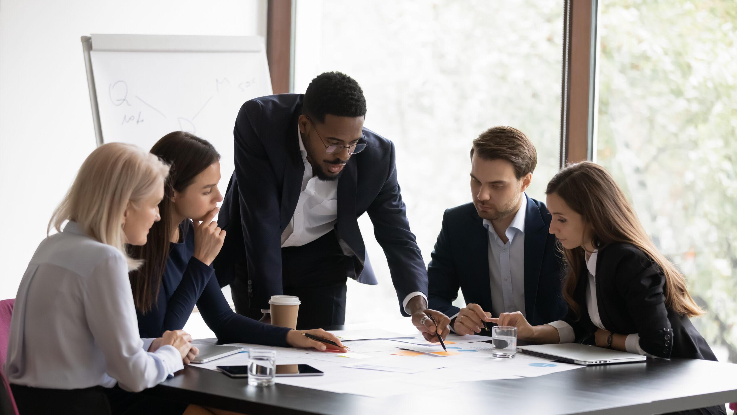 A manager collaborating with their team