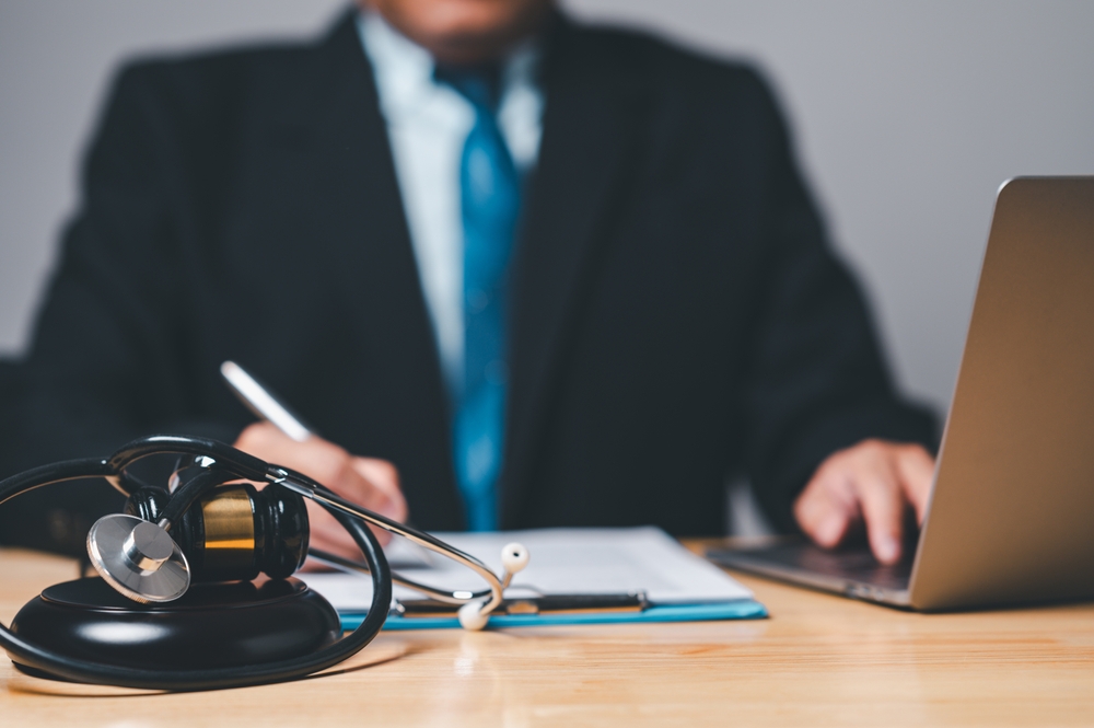 A,Personal,Injury,Lawyer,Holds,The,Authority,In,Law,To A personal injury attorney sitting at his desk.